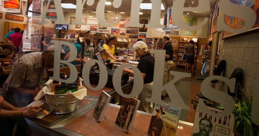 a view of a bookstore sales area through a glass window