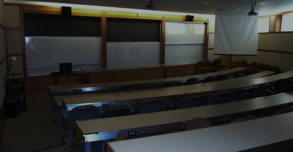 An empty and darkened college classroom